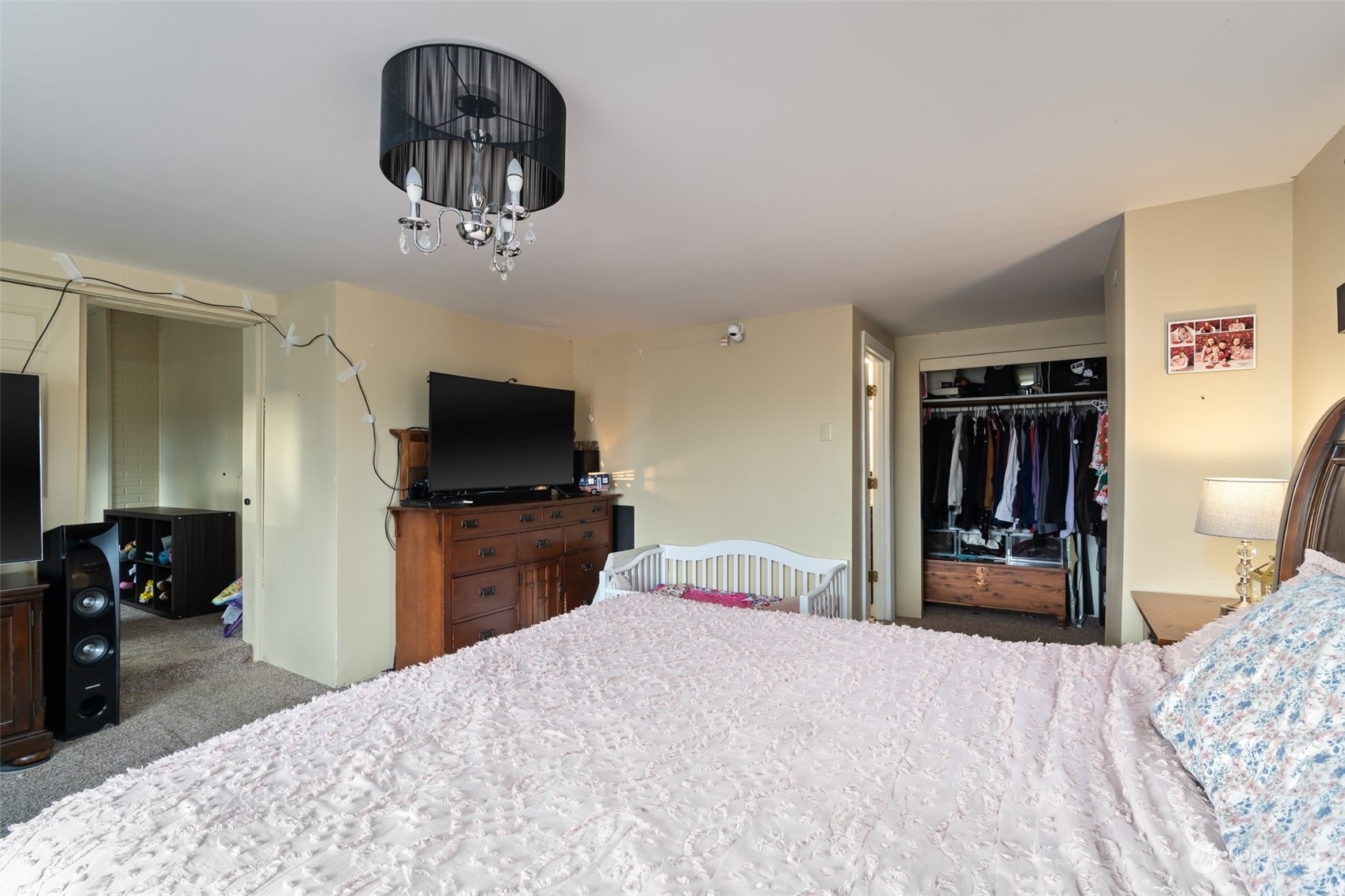 73 East Main Street Chehalis, WA 98532 - Photo 16 of 35 a bedroom with a bed and a flat screen tv