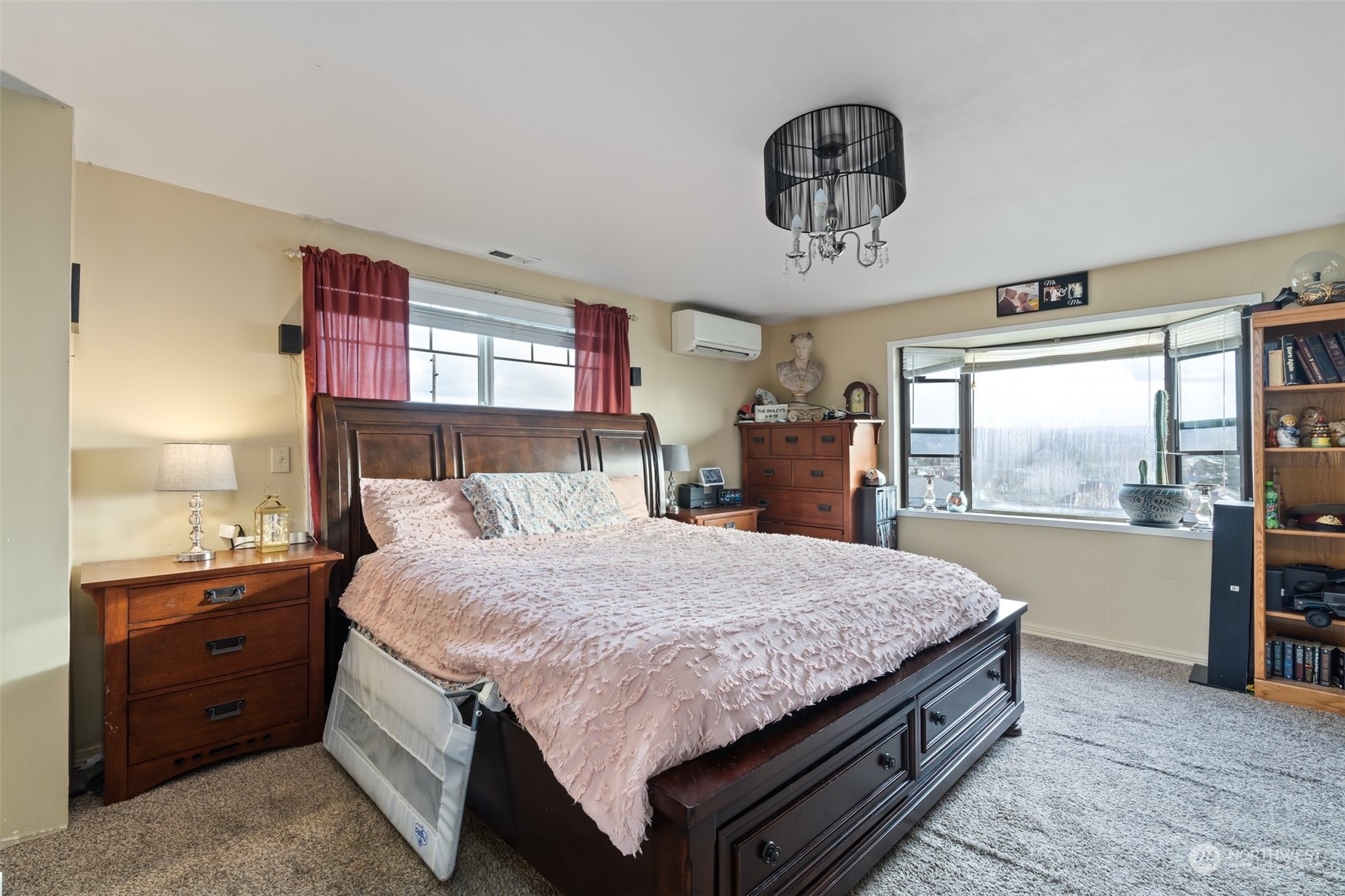 73 East Main Street Chehalis, WA 98532 - Photo 17 of 35 a bedroom with a large bed and a chandelier