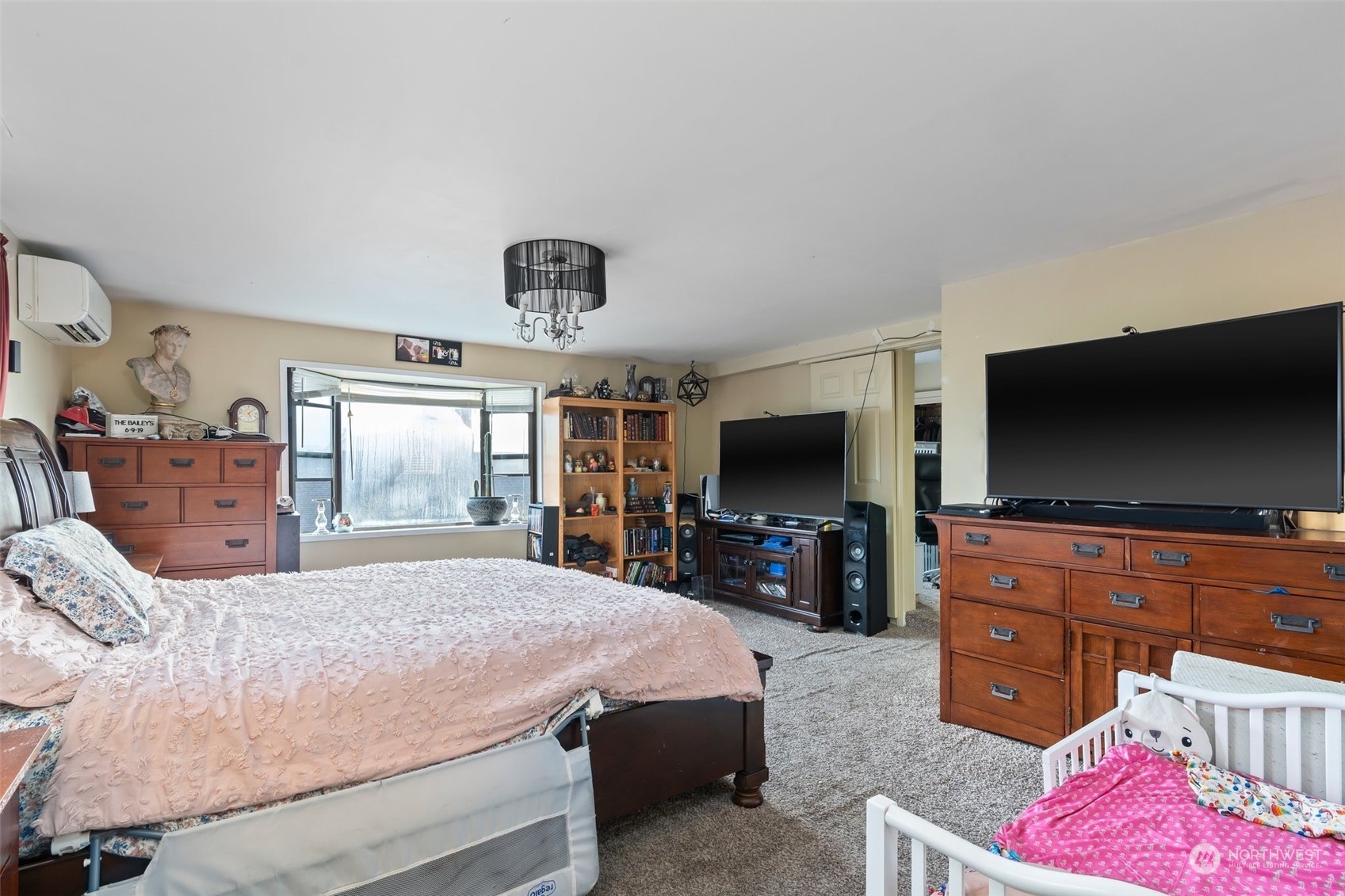 73 East Main Street Chehalis, WA 98532 - Photo 18 of 35 a bedroom with a bed and a flat screen tv