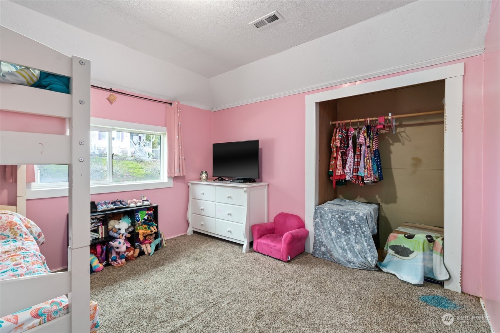 73 East Main Street Chehalis, WA 98532 - Photo 23 of 35 a bedroom with furniture and a flat screen tv