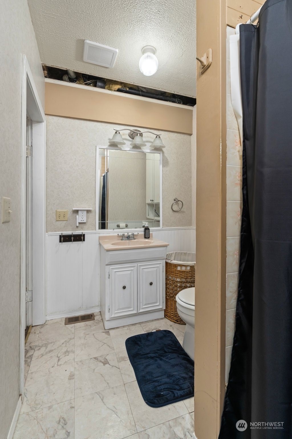 73 East Main Street Chehalis, WA 98532 - Photo 25 of 35 a spacious bathroom with a double vanity sink a mirror and shower