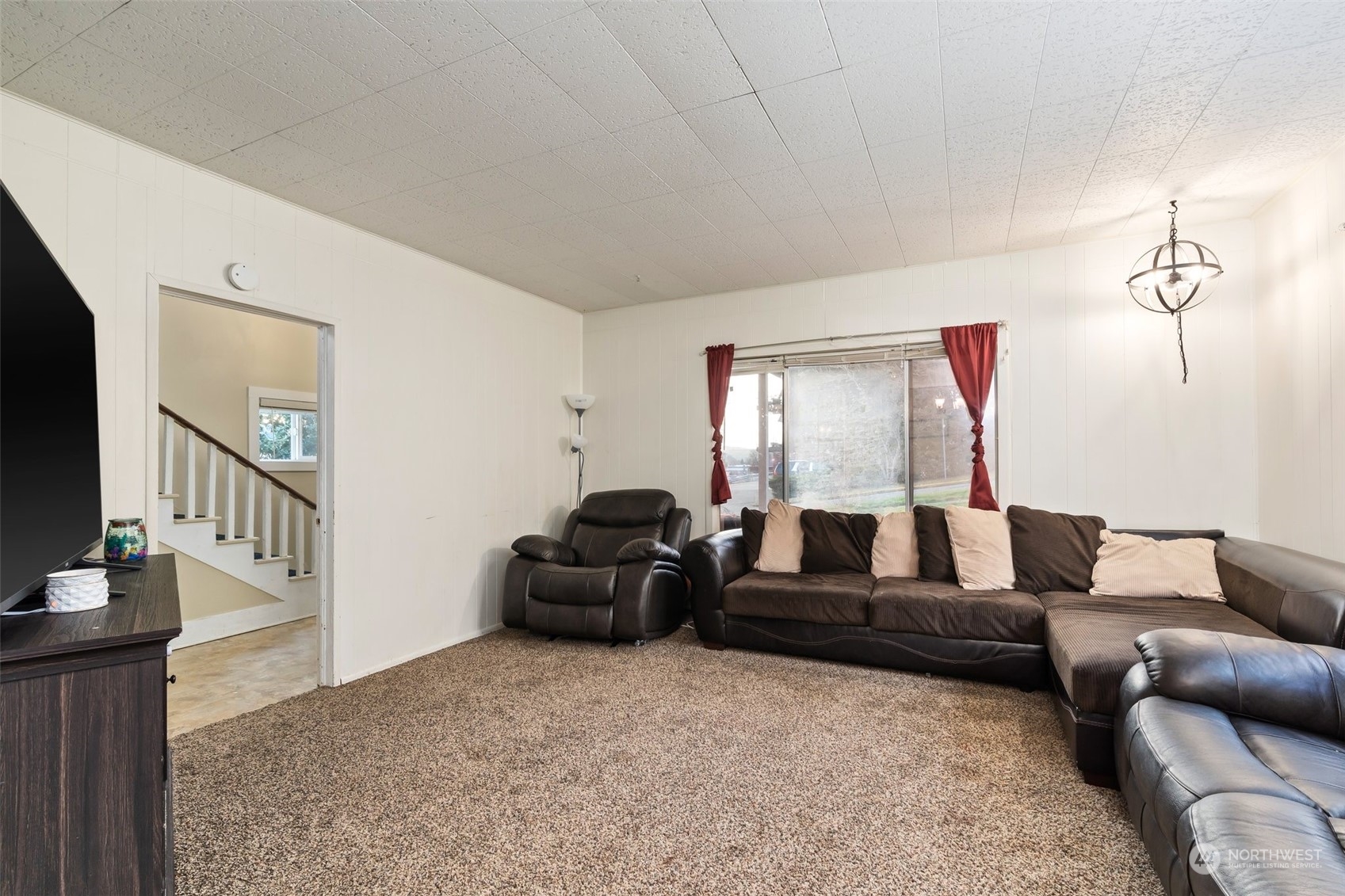 73 East Main Street Chehalis, WA 98532 - Photo 10 of 35 a living room with furniture and a flat screen tv