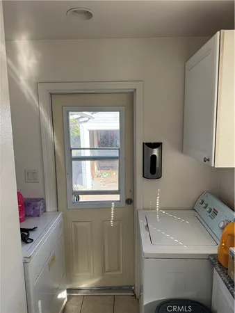 a bathroom with a sink toilet and window