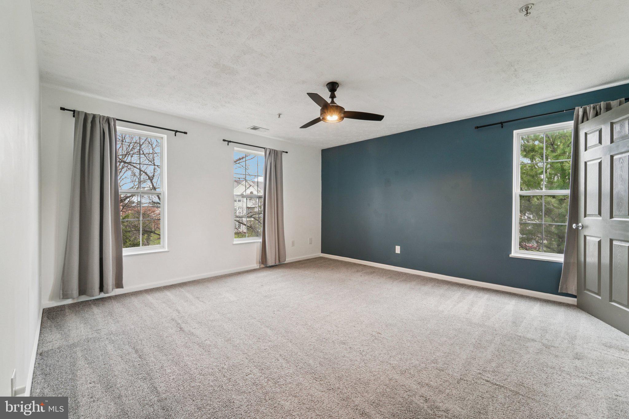 2444 Blue Spring Court, Unit 303 Odenton, MD 21113 - Photo 12 of 24 a view of an empty room with a window