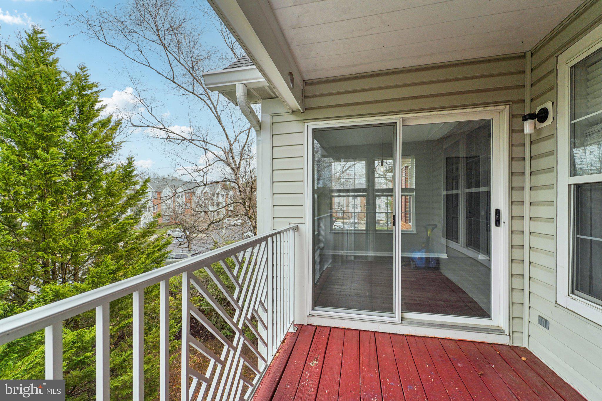 2444 Blue Spring Court, Unit 303 Odenton, MD 21113 - Photo 20 of 24 a view of balcony with wooden floor