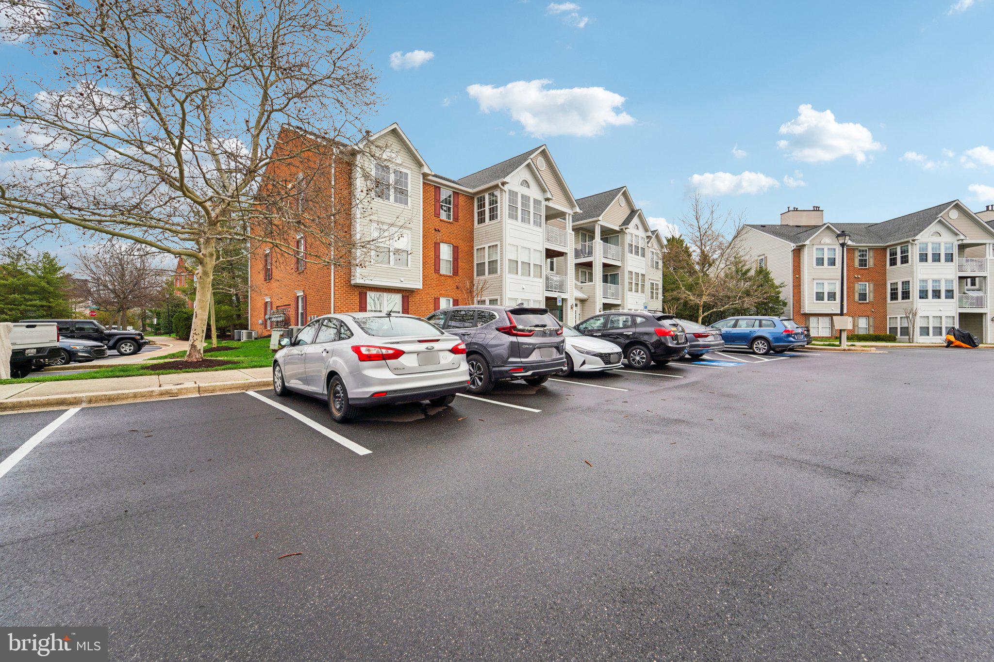 2444 Blue Spring Court, Unit 303 Odenton, MD 21113 - Photo 21 of 24 a car parked in front of a building
