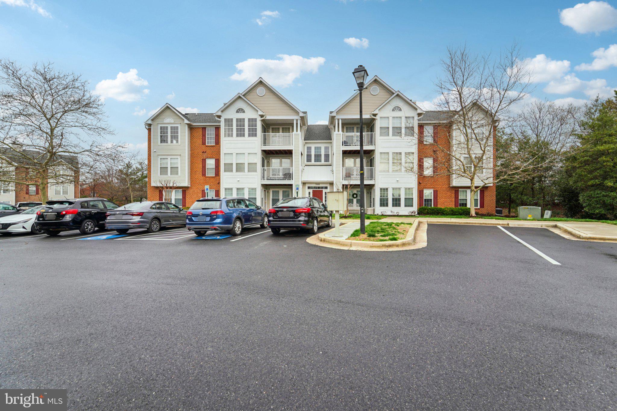 2444 Blue Spring Court, Unit 303 Odenton, MD 21113 - Photo 22 of 24 a view of a street with cars