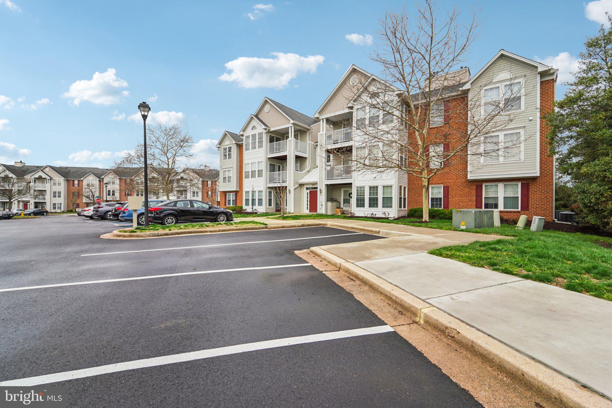 2444 Blue Spring Court, Unit 303 Odenton, MD 21113 - Photo 23 of 24 a view of a building with a street