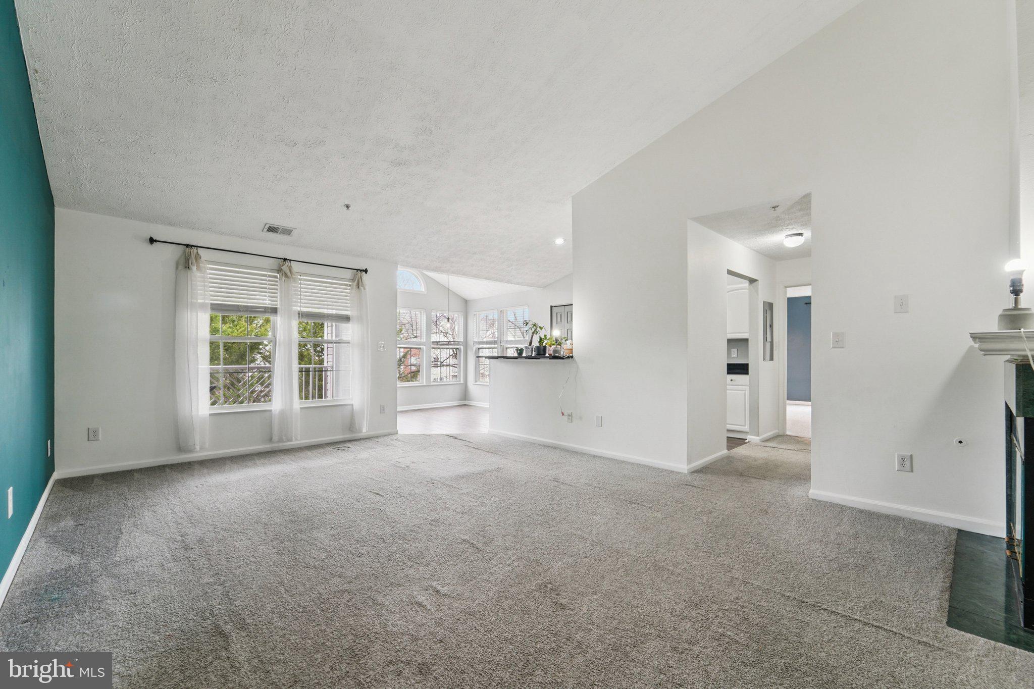 2444 Blue Spring Court, Unit 303 Odenton, MD 21113 - Photo 4 of 24 a view of an empty room with a window