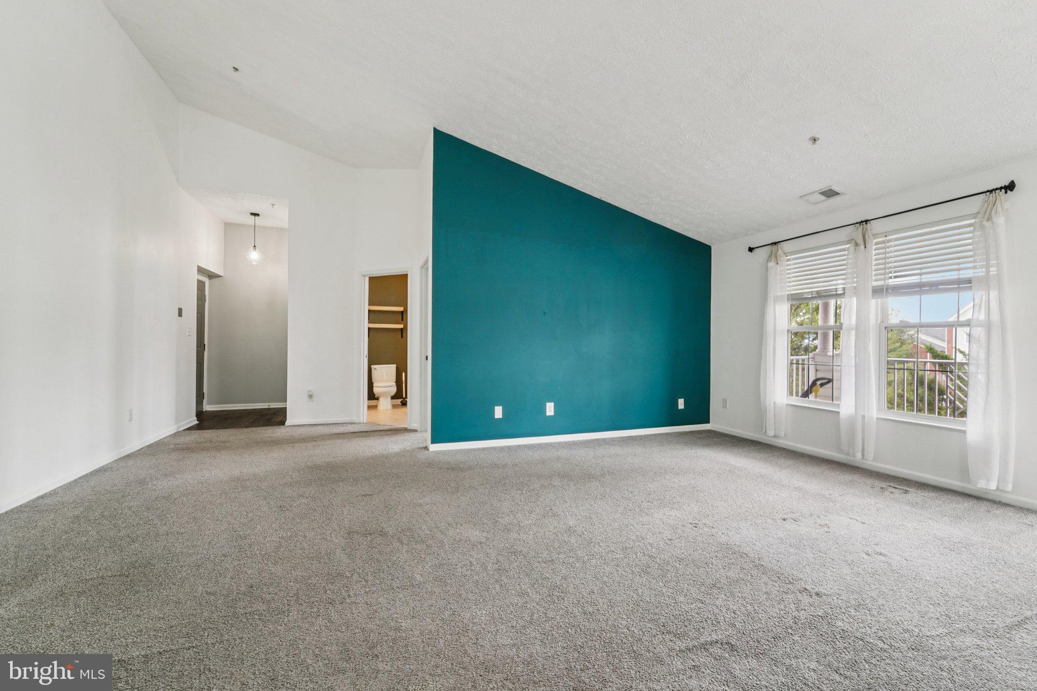 2444 Blue Spring Court, Unit 303 Odenton, MD 21113 - Photo 6 of 24 a view of an empty room with a window