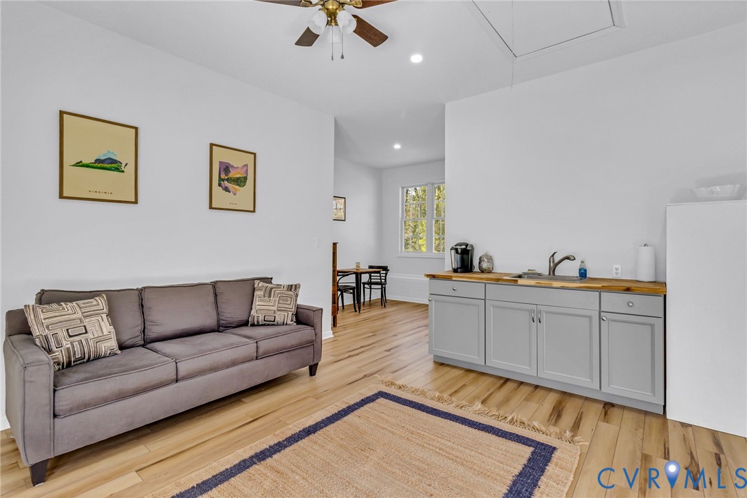 43 Ruddy Duck Road Heathsville, VA 22473 - Photo 29 of 46 a living room with furniture and a wooden floor