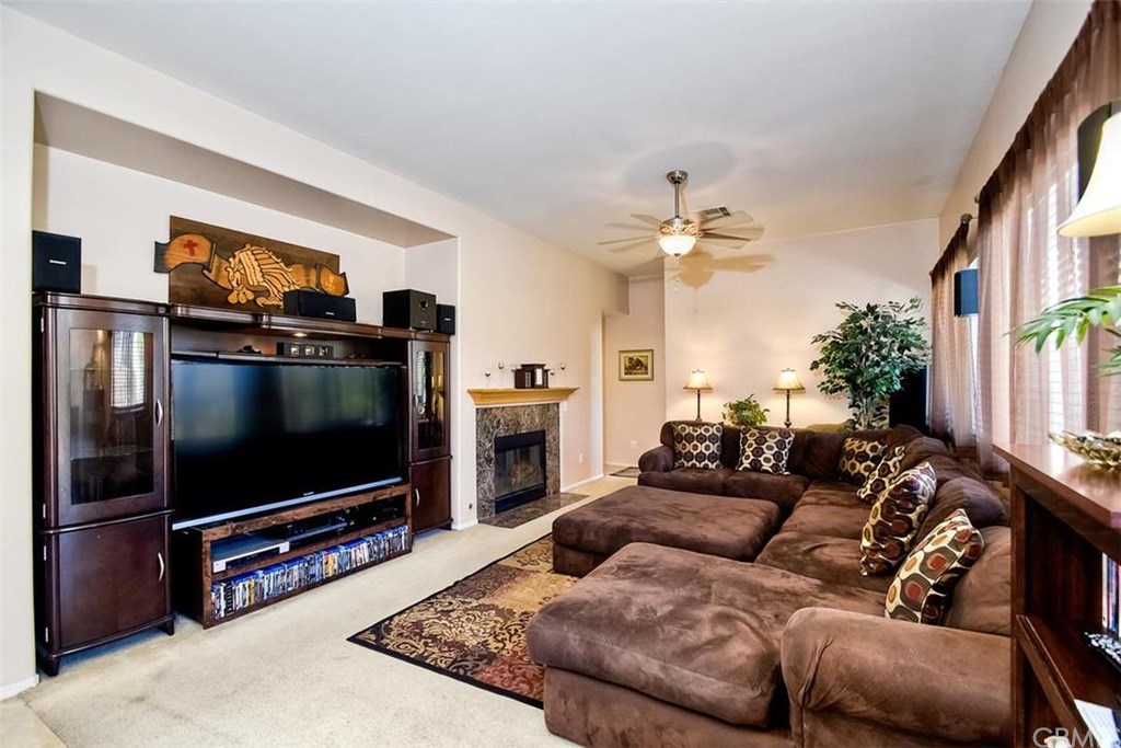 12362 Brianwood Drive Riverside, CA 92503 - Photo 1 of 1 Family room has large niche for Media center, ceiling fan, 2 large picture windows, and gas fireplace