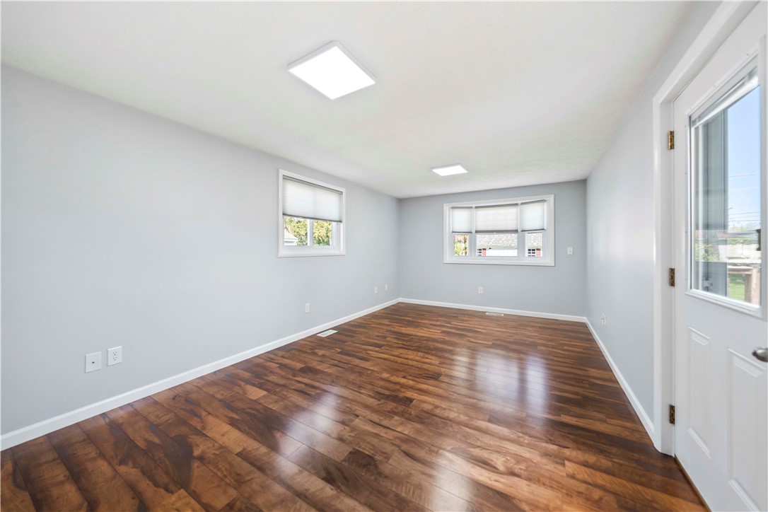 118 Queensboro Road Irondequoit, NY 14609 - Photo 13 of 40 Family room leads to back deck