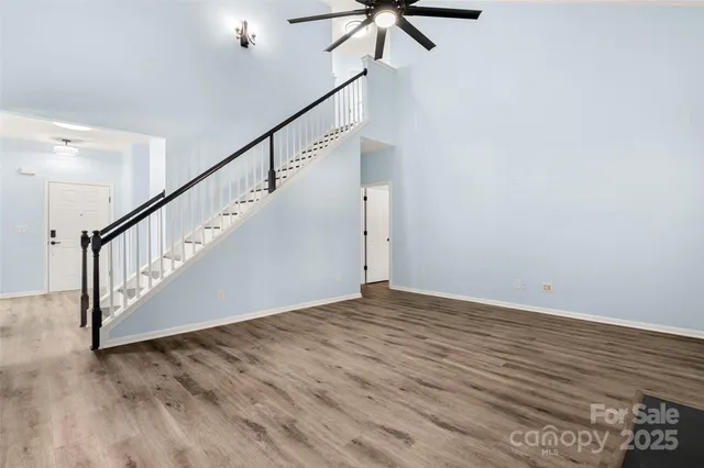 a view of an entryway with wooden floor