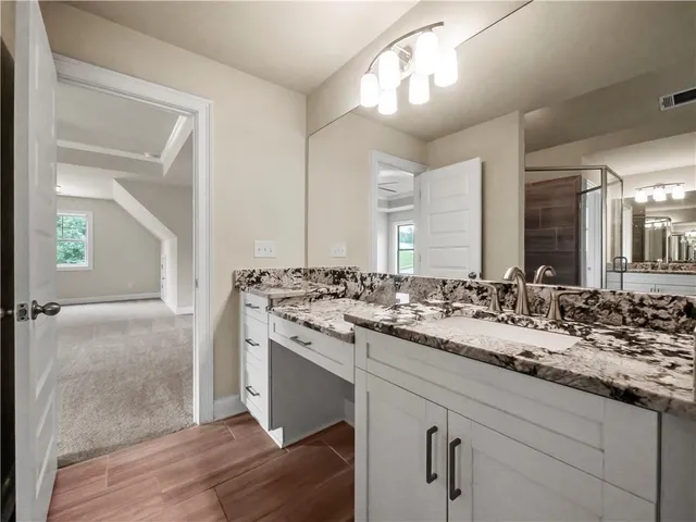 a bathroom with a sink and a mirror