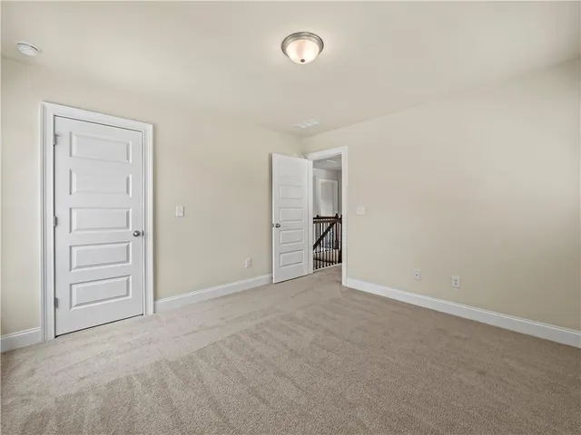 an empty room with closet area