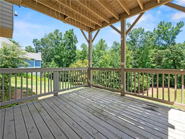 a view of balcony with wooden floor