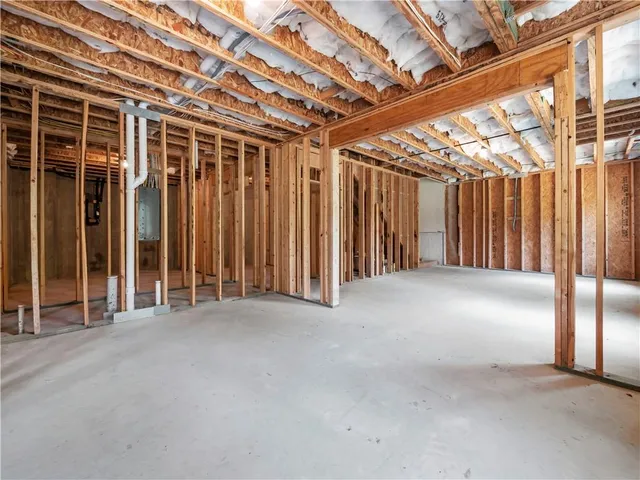 a view of an empty room with wooden walls