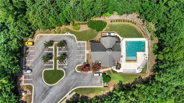 a front view of house with outdoor space and swimming pool