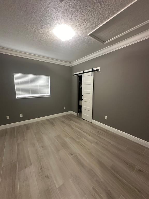 445 Northeast 1st Street Pompano Beach, FL 33060 - Photo 13 of 24 an empty room with wooden floor and windows