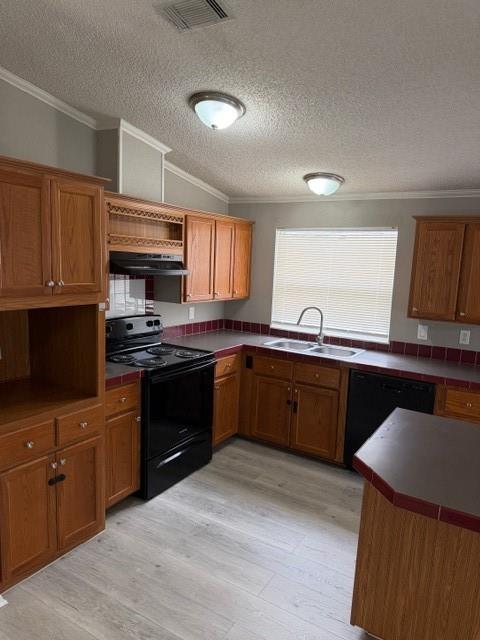 2321 Ridgeview Street Fort Worth, TX 76119 - Photo 3 of 10 Kitchen featuring wood-finish cabinetry, black appliances, tile countertops with a contrasting tile backsplash, and light wood-finish flooring