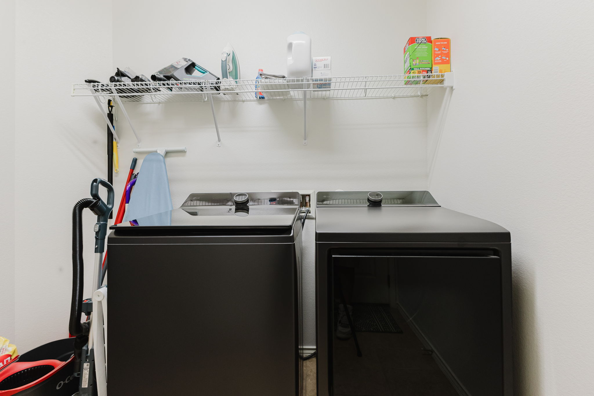 2292 Intrepid Drive Buda, TX 78610 - Photo 19 of 38 Laundry room featuring washing machine and clothes dryer