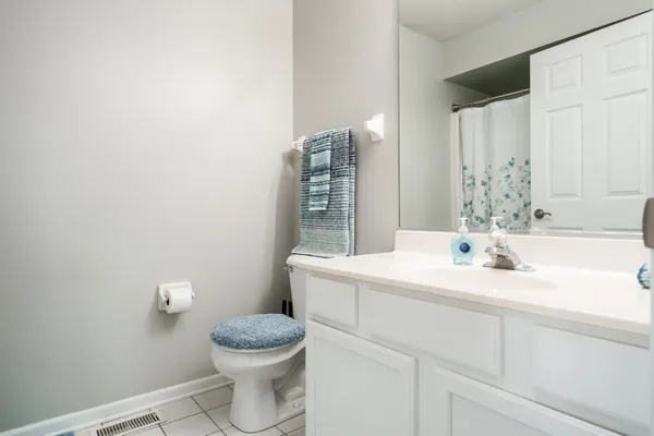 a kitchen with a sink cabinets and window