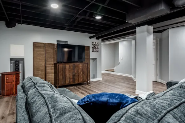 a bedroom with a bed and pillows
