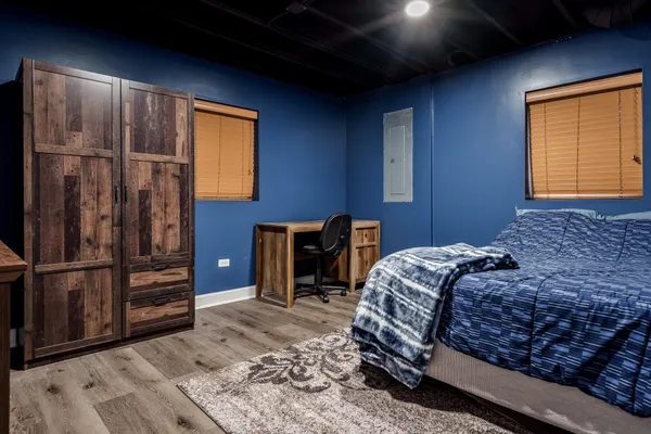 a view of room with stairs and wooden floor
