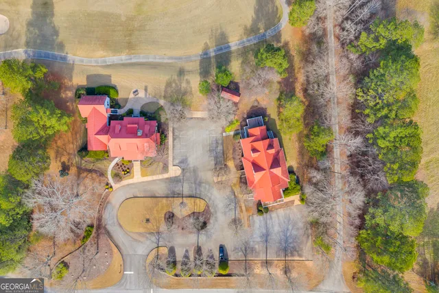 a view of a house with swimming pool and a porch with furniture