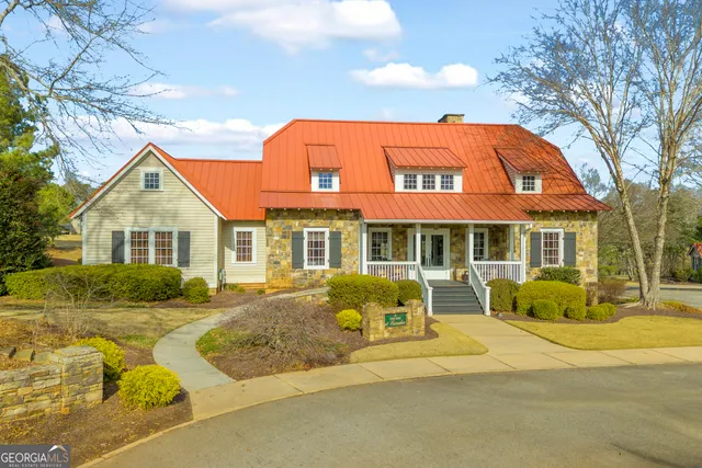 a view of a house with backyard porch and sitting area
