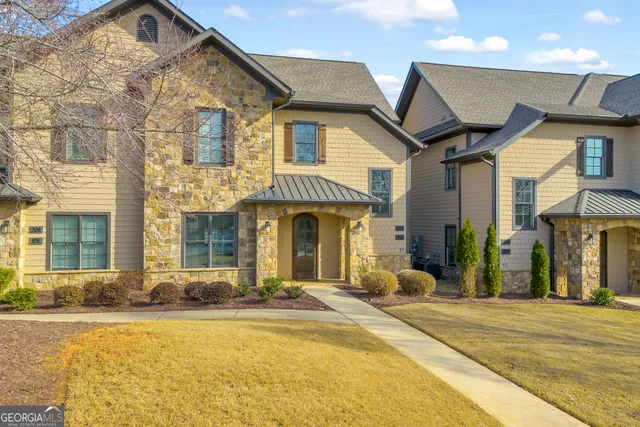 a kitchen with refrigerator cabinets dining table and chairs