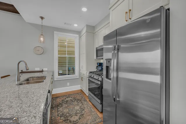 a spacious bedroom with a bed and a couch