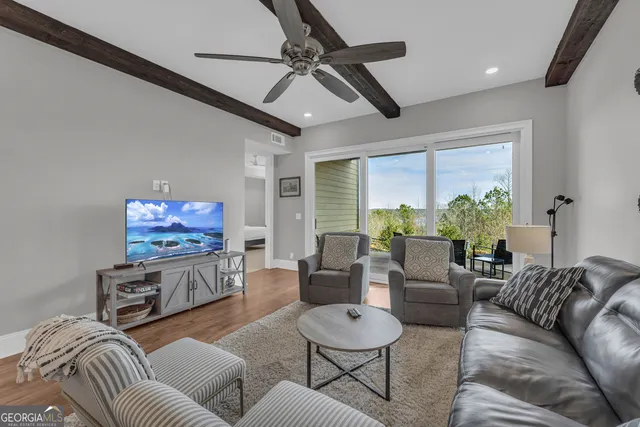 a bathroom with a granite countertop sink mirror and shower