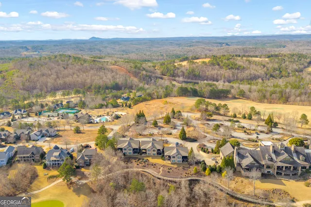 a view of a swimming pool with an outdoor seating