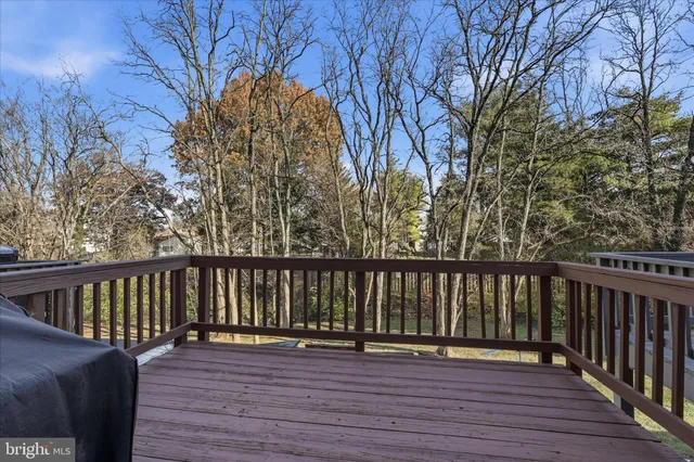 a view of a wooden deck with chairs