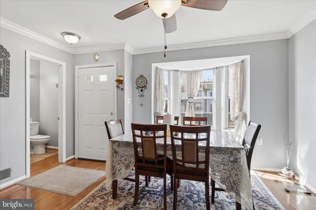 a bathroom with a toilet sink and vanity