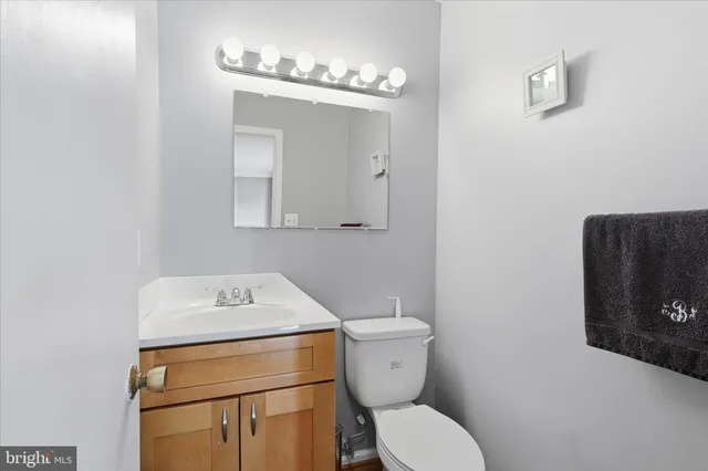 a work room with furniture and flat screen tv