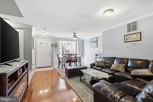 a kitchen with stainless steel appliances granite countertop a refrigerator a sink a stove and cabinets