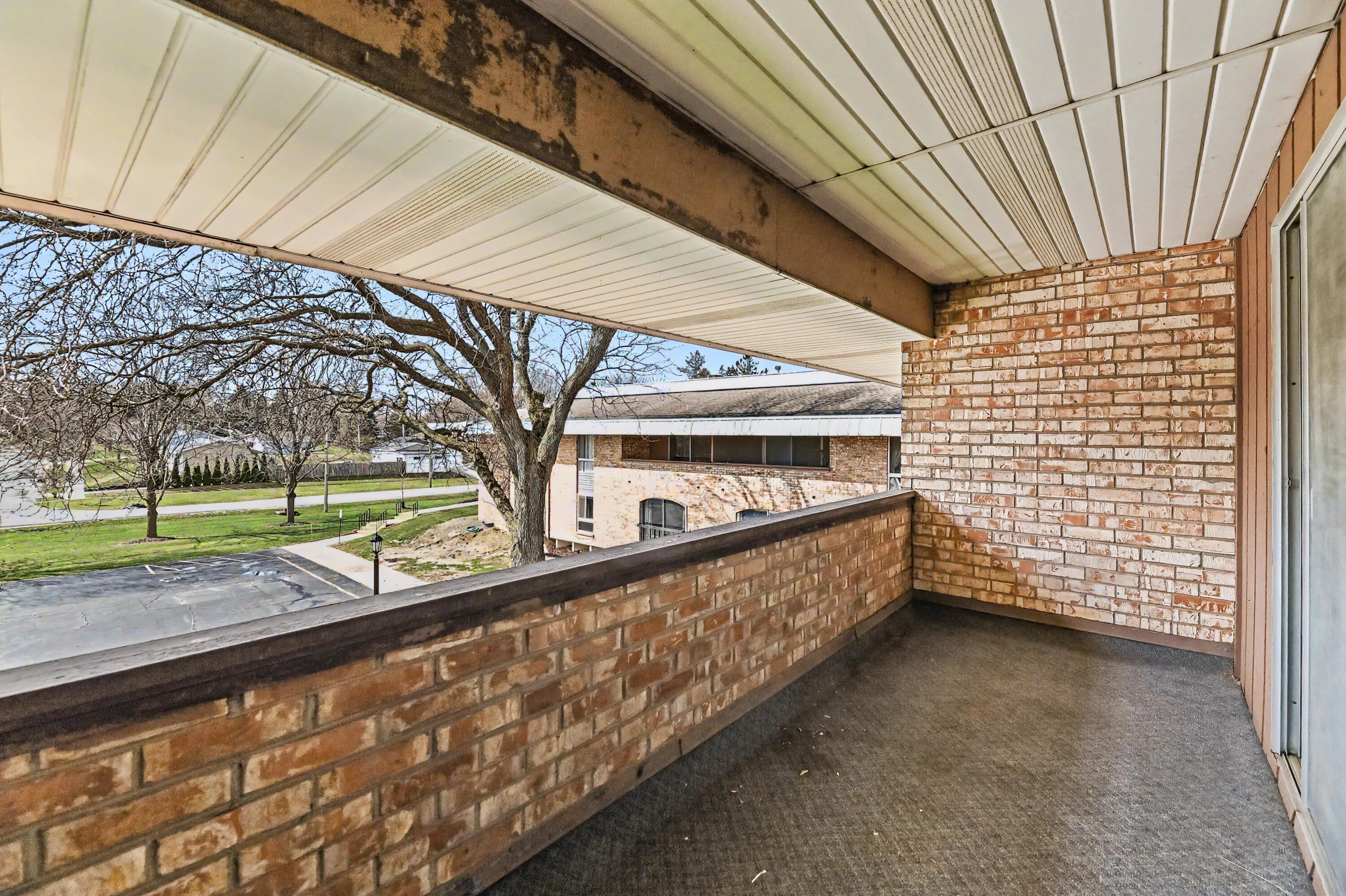 11926 West Mill Road, Unit 4 Milwaukee, WI 53225 - Photo 17 of 40 Long Covered balcony