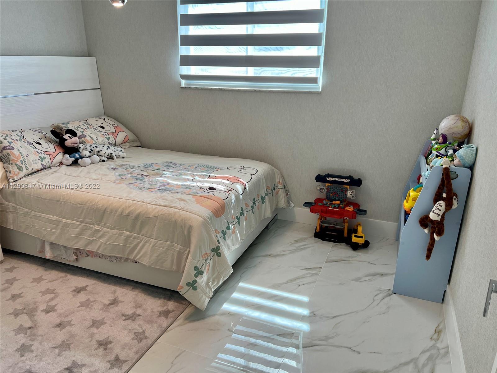 17841 Southwest 113th Avenue Miami, FL 33157 - Photo 12 of 20 a bedroom with a bed and a window