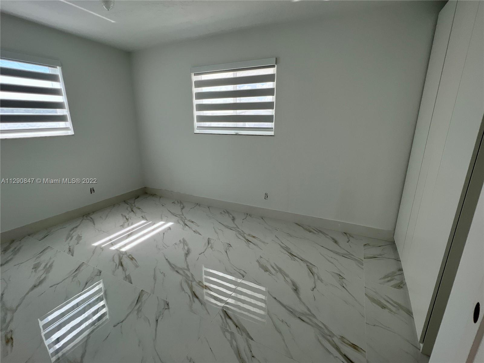 17841 Southwest 113th Avenue Miami, FL 33157 - Photo 15 of 20 a view of a room with window