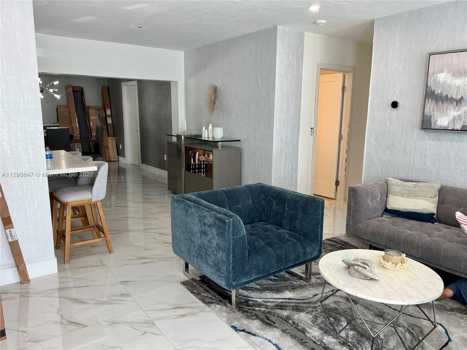 17841 Southwest 113th Avenue Miami, FL 33157 - Photo 20 of 20 a living room with furniture and a dining table