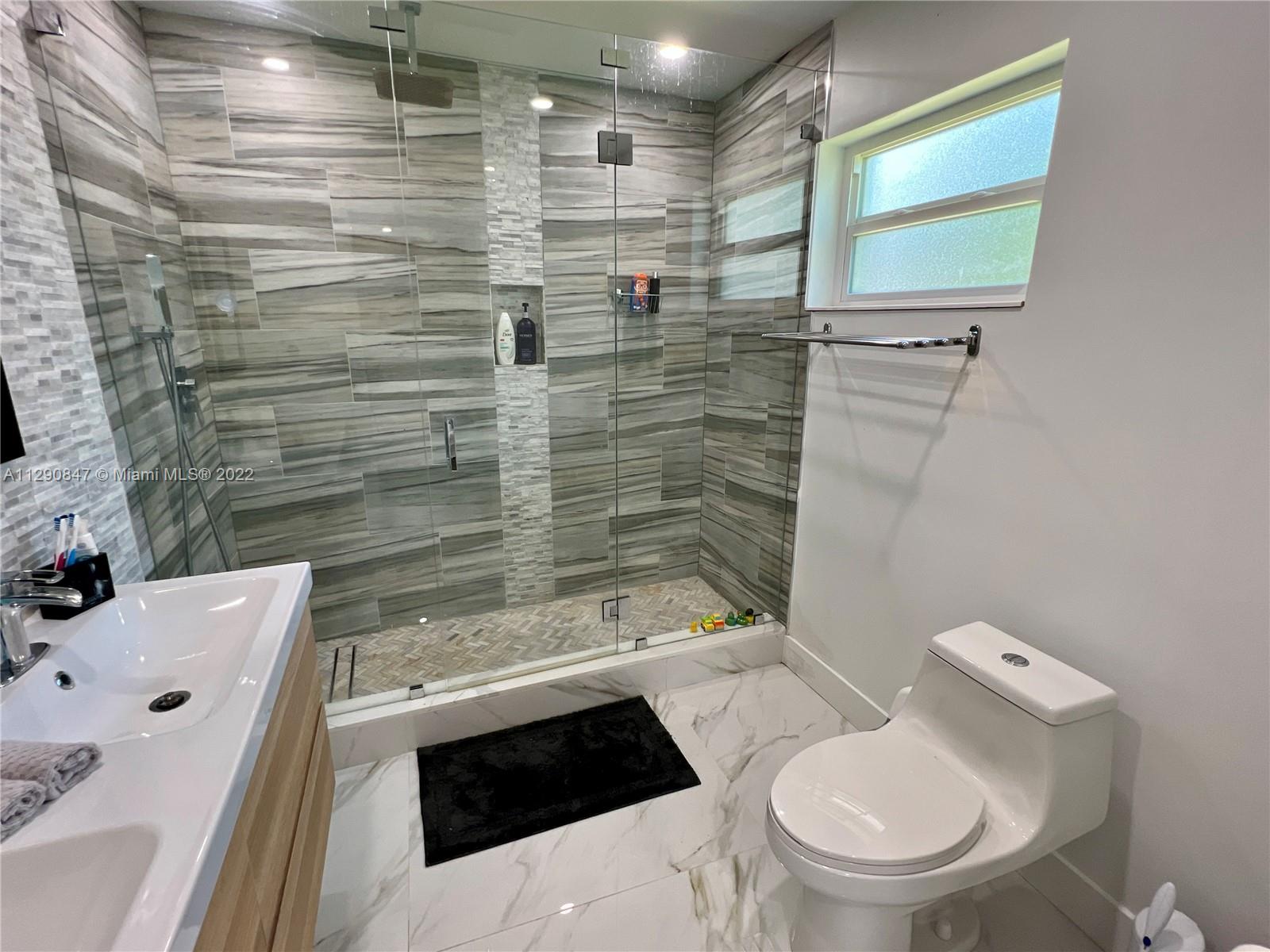 17841 Southwest 113th Avenue Miami, FL 33157 - Photo 3 of 20 a bathroom with a sink a toilet and shower