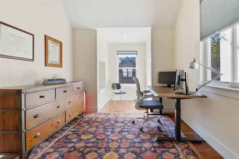a bedroom with furniture and a window