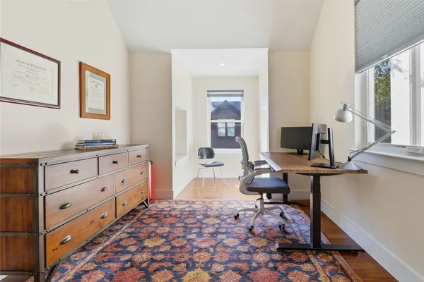 a bedroom with furniture and a window