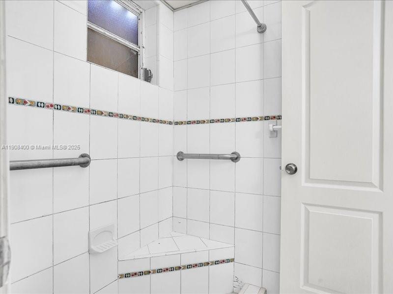 8990 Southwest 24th Street, Unit 33 Miami, FL 33165 - Photo 13 of 22 a bathroom with a shower