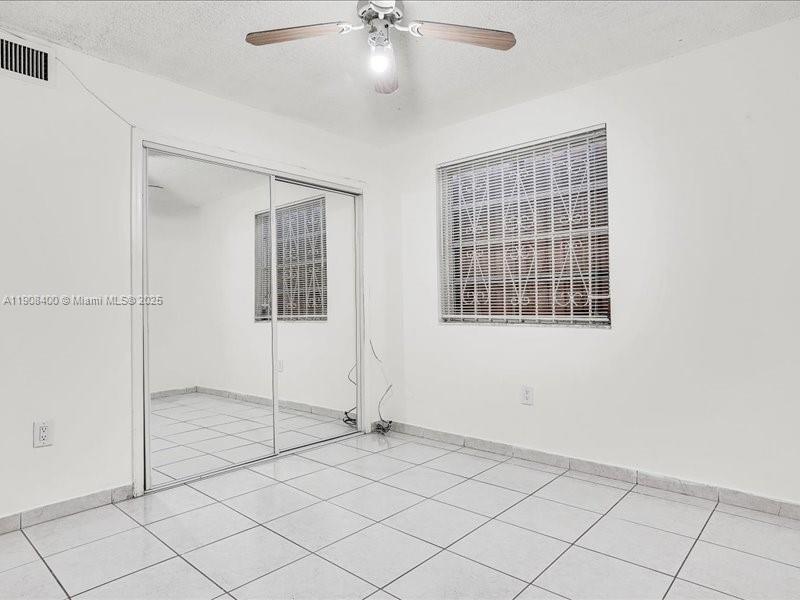 8990 Southwest 24th Street, Unit 33 Miami, FL 33165 - Photo 17 of 22 a view of an empty room with a window