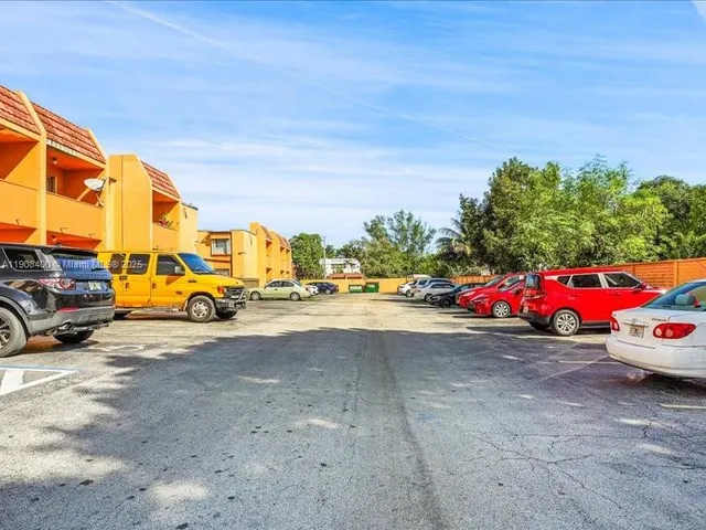 a view of street with parked cars
