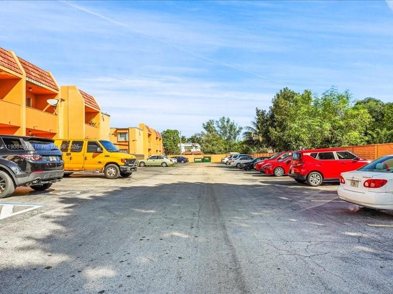 8990 Southwest 24th Street, Unit 33 Miami, FL 33165 - Photo 22 of 22 a view of street with parked cars